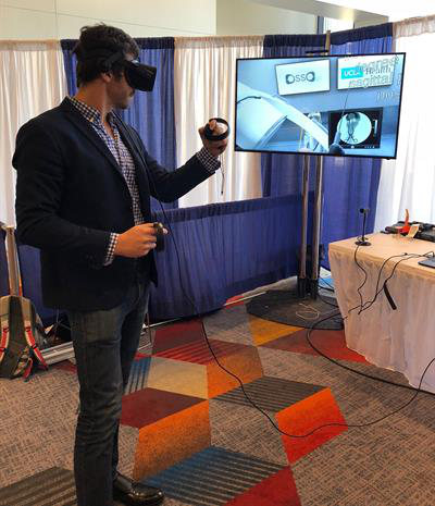Dr. Justin Barad demonstrates the Osso VR virtual surgery simulator