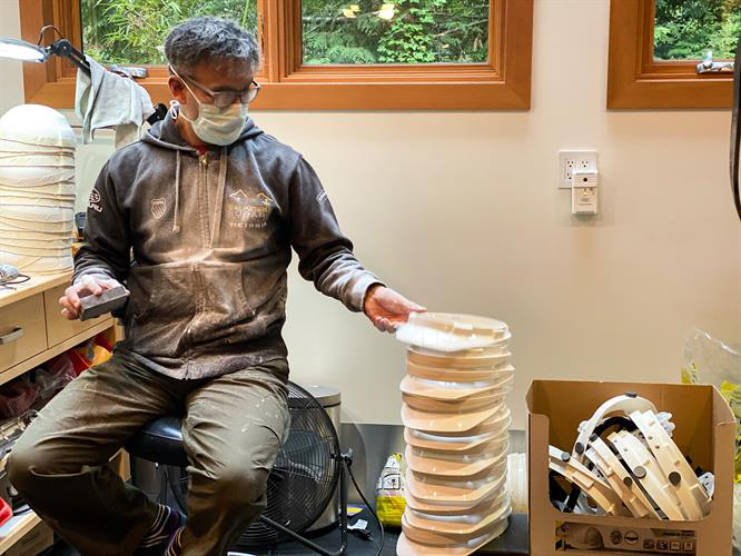Yamaoka making shields at his garage in Vancouver.